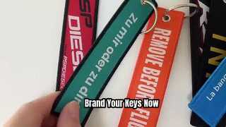 संतुष्टि की गारंटी कस्टम लोगो कढ़ाई बुना पॉलिएस्टर चाबी का गुच्छा