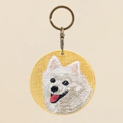 Buy Sunny Smile Dog Keychain - Artisan Embroidery on Buttercup Yellow Canvas online manufacture