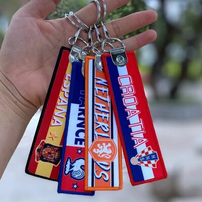 comprar Etiqueta de chaveiro tecido personalizada com anel de metal, patch com logotipo personalizado, etiqueta de bordado de luxo online manufacture