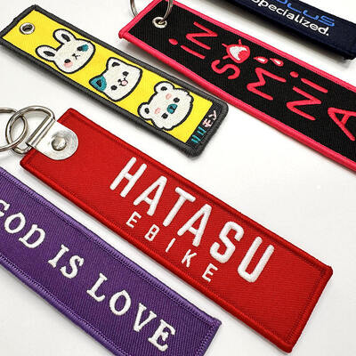 comprar Chave de chave bordada personalizada com bordado de dois lados Logotipo personalizado e chave de liga de zinco online manufacture