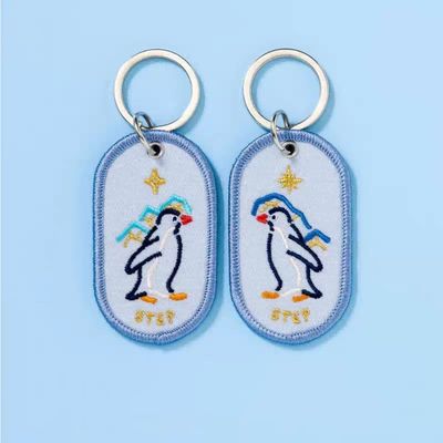 Heartwarming Penguin Pair Keychains | Bespoke Keepsakes | Double-Sided Embroidery | Starry Gradient Fabric